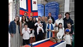 Group of people at the baptism of RNLI Helms two sons