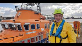 David 'Scotty' Scott Humber RNLI Lifeboat Operations Manager in front of Humber RNLI Severn class lifeboat