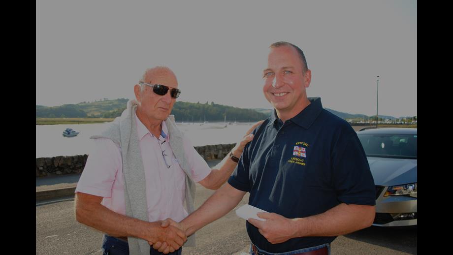 John Robertson Receives 30 year service medal from Jim Prentice at Kippford RNLI.