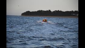 Wells RNLI D class lifeboat launches to three people cut off by the tide with a crew of three on a spring tide