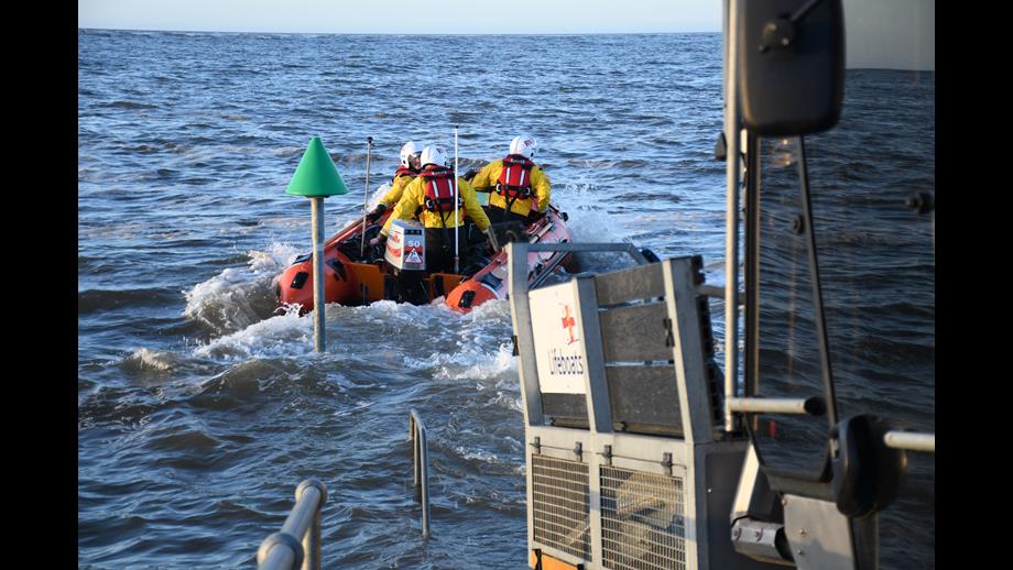 'Peter Wilcox' Wells RNLI D class lifeboat launching on spring tide