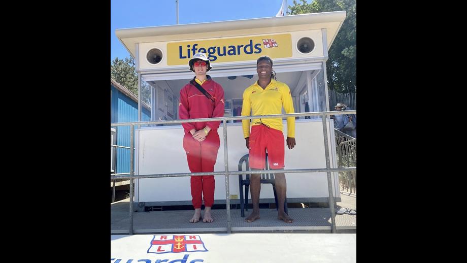 Wells Beach Lifeguards Harry and Ollie on Wells Beach in full uniform