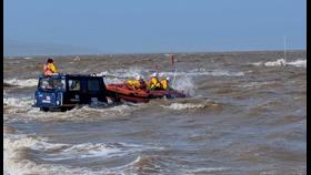 The D class lifeboat recovers onto the BV launch vehicle in choppy conditions on West Kirby Marine Lake