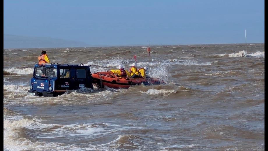 The D class lifeboat recovers onto the BV launch vehicle in choppy conditions on West Kirby Marine Lake