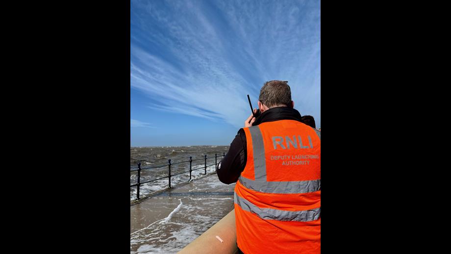 Launch Authority looks out towards the D class lifeboat as they perform a welfare check on a kite surfer