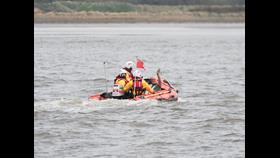 Crew with Casualty heading back to shore