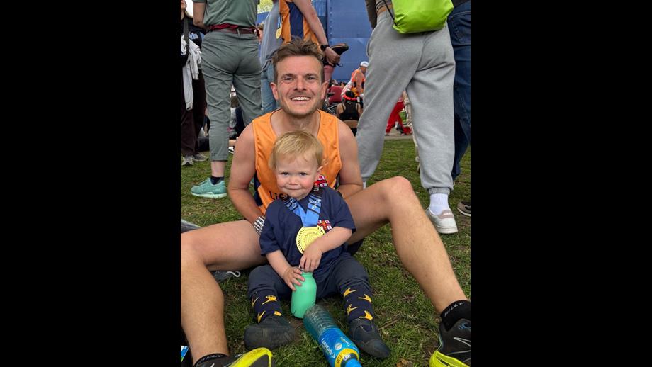 Jonny with his young son wearing his London Marathon medal after the race
