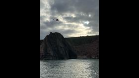 Peterhead RNLI providing cliffside safety cover from the water 