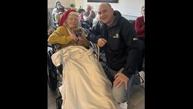 Anita Twine with RNLI James Betteridge at Anita's 105 birthday celebration