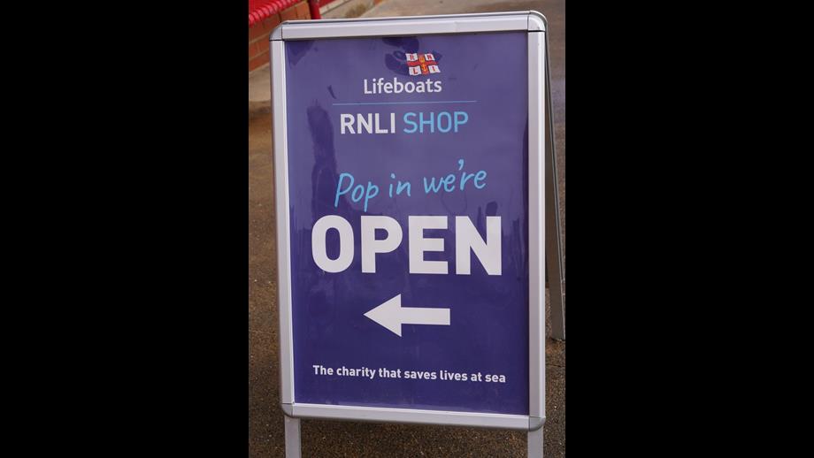 A Pop in We're Open sign outside the shop