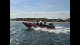 The Mudeford RNLI Atlantic 85 lifeboat, Henrietta H, responding to a call out.