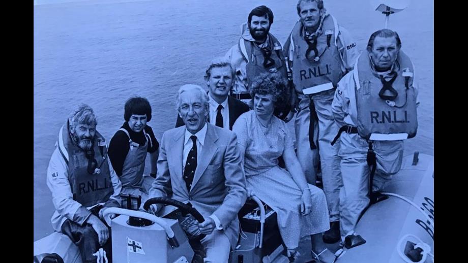 Brian Hadler (lefft rear) onboard British Diver 1 with TV presenter Raymond Baxter during the lifeboats naming ceremony.