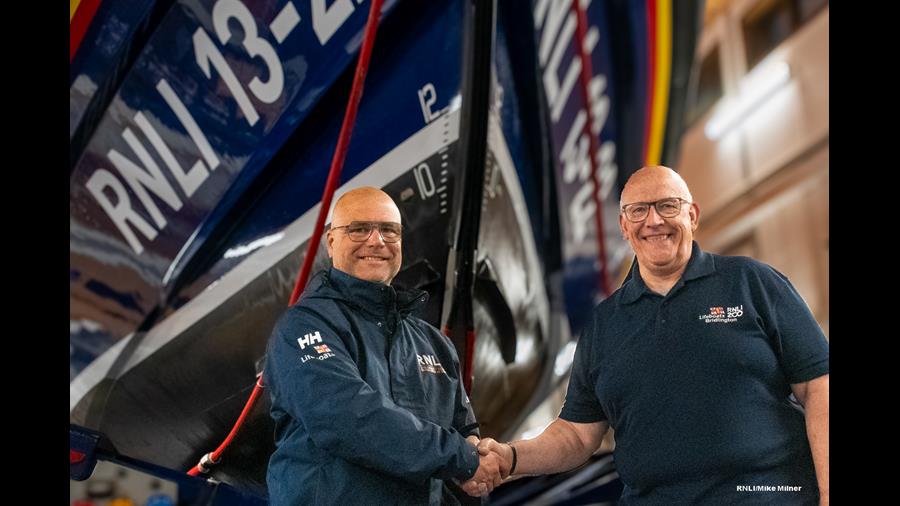 Jake Bennet (left) takes over as Lifeboat Operations Manager from Steve Clarke (right).