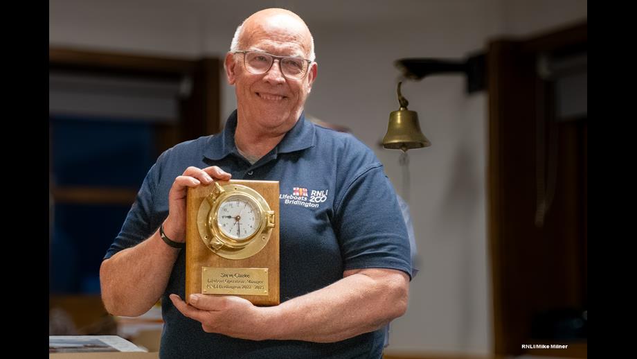 Steve Clarke presented with brass clock and plaque.