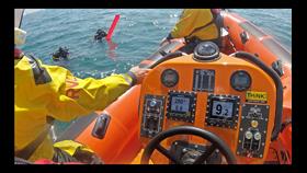 Littlehampton lifeboat crew locate two of the divers in the water during the rescue
