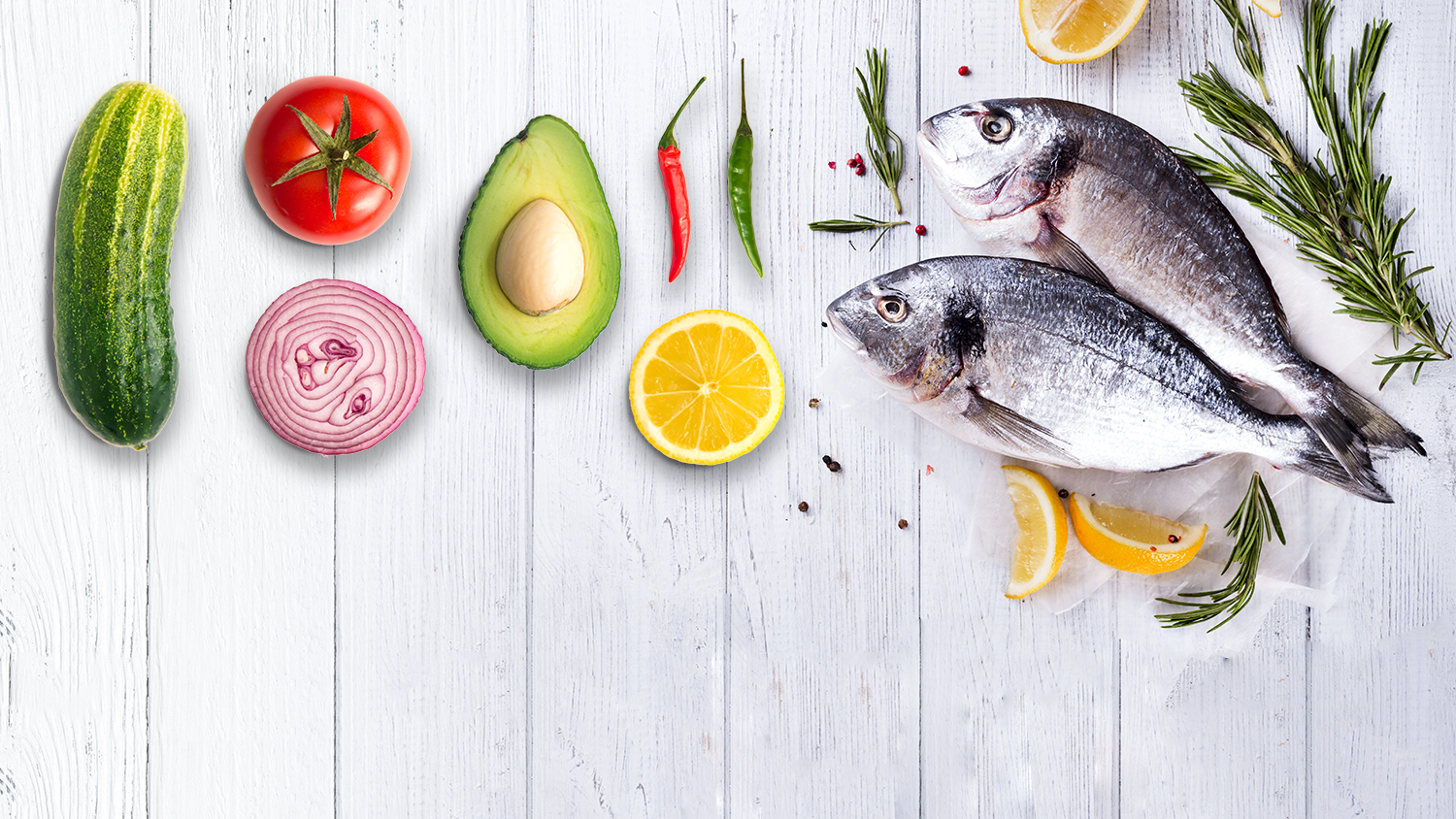 Fish Supper ingredients. Fish, rosemary, orange, avocado, onion, tomato, cucumber and chilli. Photo: Bright Blue Day
