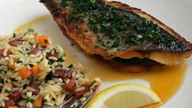 Sea bream served on a bed of squid and chorizo orzo