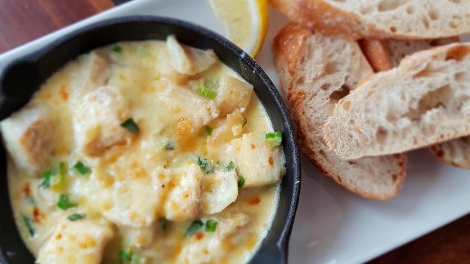 Creamy haddock served with white sourdough bread