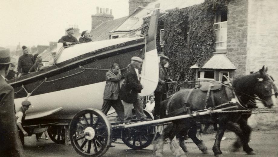 1933: Newquay’s self-righting class lifeboat Admiral Sir George Back on a carriage with five crew onboard being towed by horses