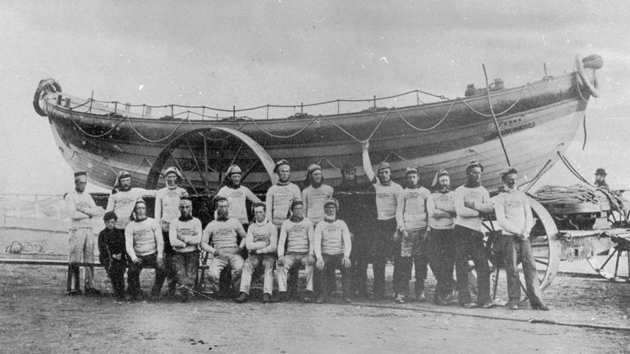 Redcar crew lined up in front of their lifeboat, Emma. Circa. 1877.