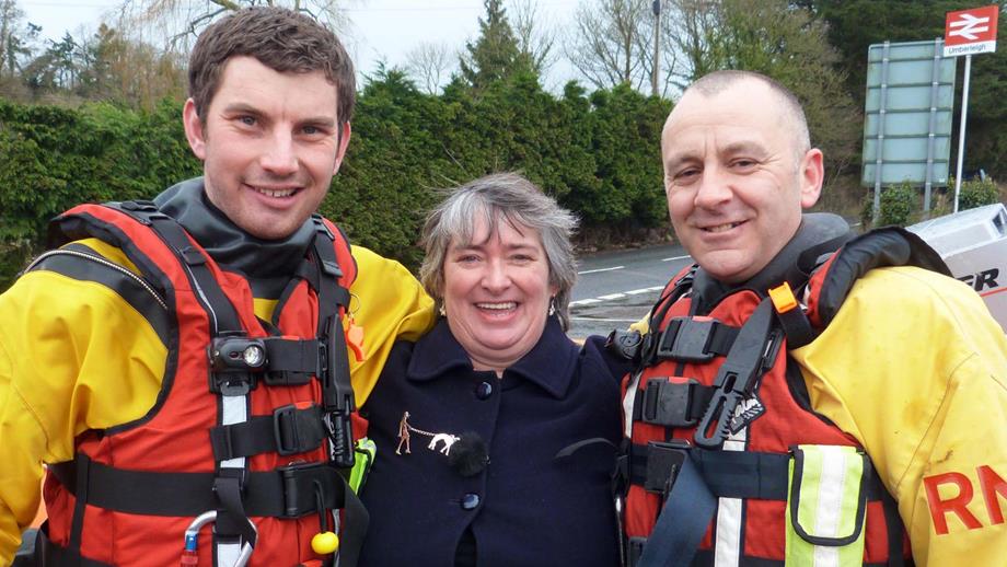 Flood Rescue Team members Chris Missen and Paul Eastment with Vanessa Glover