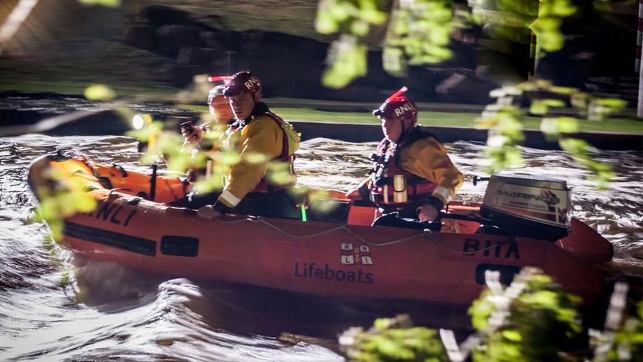 RNLI Flood Rescue Team members Paul, Chris and Martin take part in a reconstruction of the Umberleigh rescue