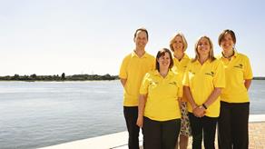 Group shot of the RNLI staff Safety Get Onboard team at RNLI College