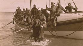 Lifeboat crew helping survivors of the Fethard lifeboat disaster in 1914