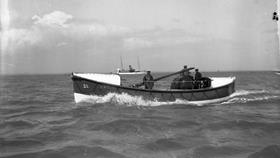 Black and white image of Cloughey lifeboat, William Maynard, while on trials