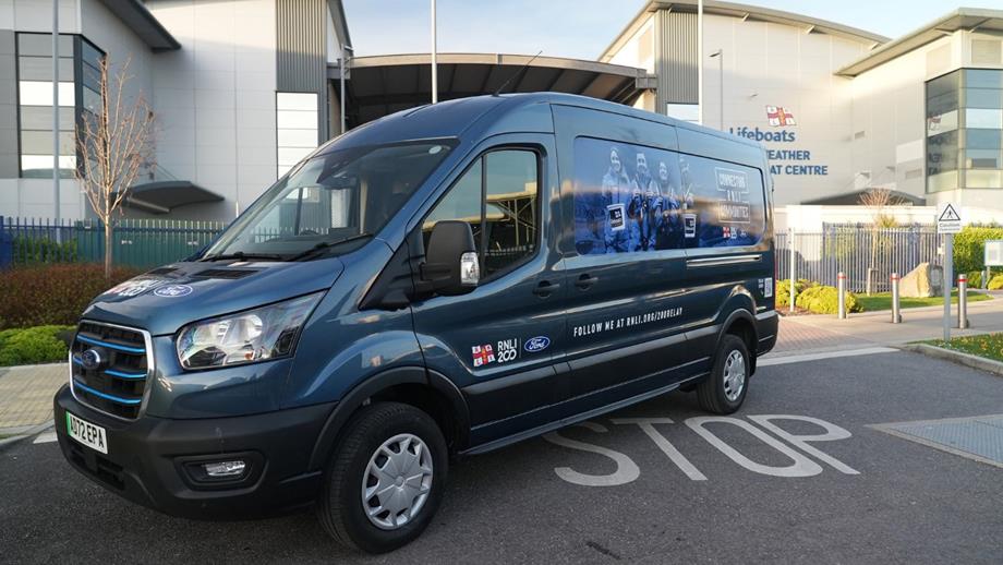 The all-electric Ford E-Transit van parked outside the All-weather Lifeboat Centre in Poole. The van is personalised with RNLI 200 imagery and branding.