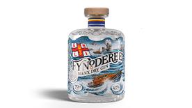 A bottle of Fynoderee Manx Dry Gin, illustrated with an RNLI lifeboat and waves