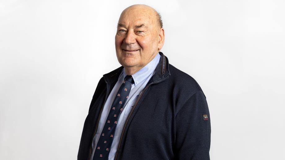 Headshot of a man wearing a suit