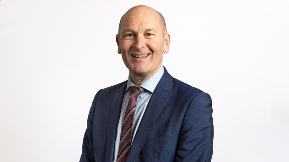 Headshot of a man wearing a suit
