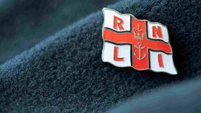 RNLI pin badge on jumper