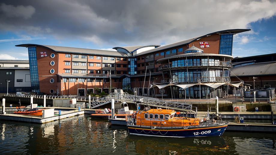A view from the water looking back at the RNLI College in Poole, Dorset.