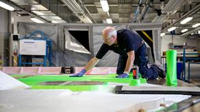 A male RNLI staff member working in the All-Weather Lifeboat Centre (ALC) at RNLI Support Centre in Poole. 