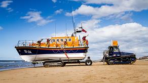 Rhyl RNLI’s Mersey class lifeboat, Lil Cunningham 12-24, being launched by her launch and recovery tractor