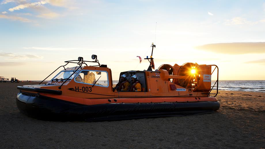 Hunstanton lifeboat volunteers onboard their rescue hovercraft, The Hunstanton Flyer H-003, at sunset