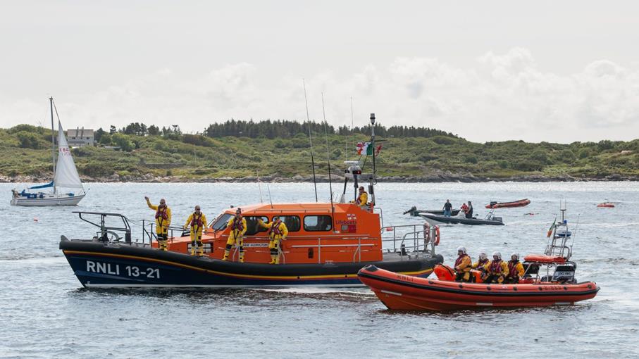 Clifden lifeboat crew waving from their two lifeboats 