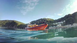 Lifeboat shot half in the water on a sunny day