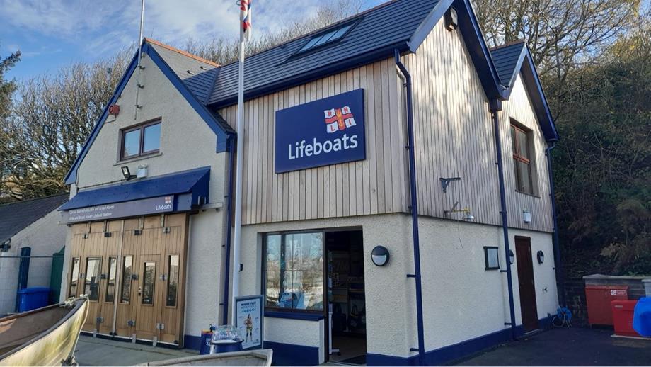 Photo of Little and Broad Haven's RNLI Shop from street level, facing the building.