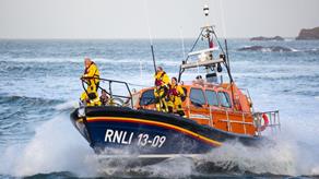 Ilfracombe's Shannon class lifeboat, The Barry and Peggy High Foundation, at sea with crew members on board 