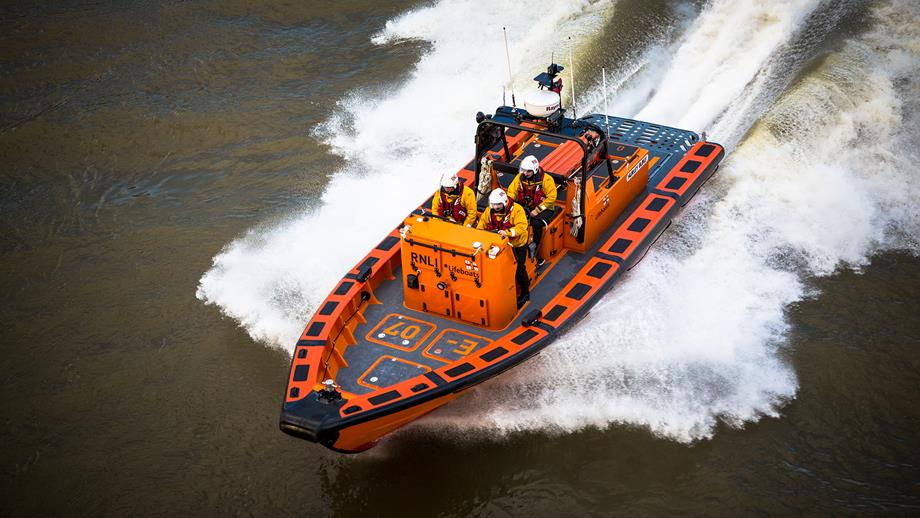 Tower crew onboard their E class lifeboat, Hurley Burly E-07, on the River Thames