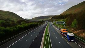 An RNLI lifeboat being transported via motorway