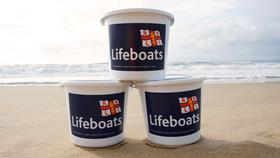 Fundraising buckets on the beach