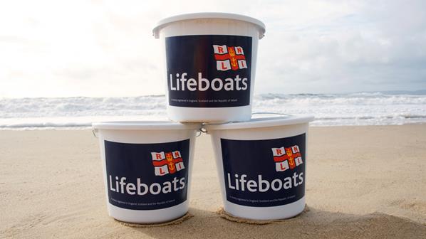 Fundraising buckets on the beach