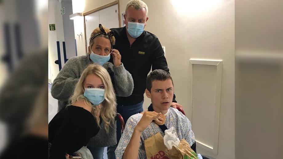 Louis with his family at the hospital after the accident