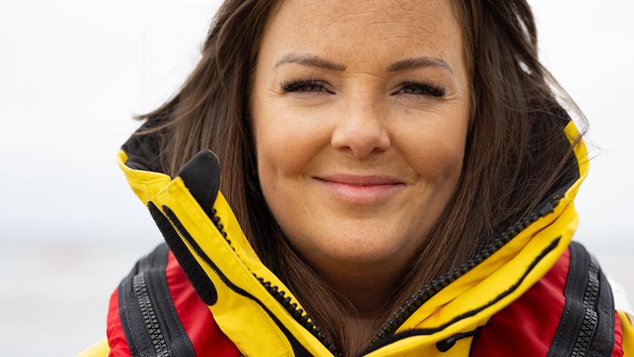 A portrait of Larne Crew Member Sami Agnew, who is smiling at the camera 