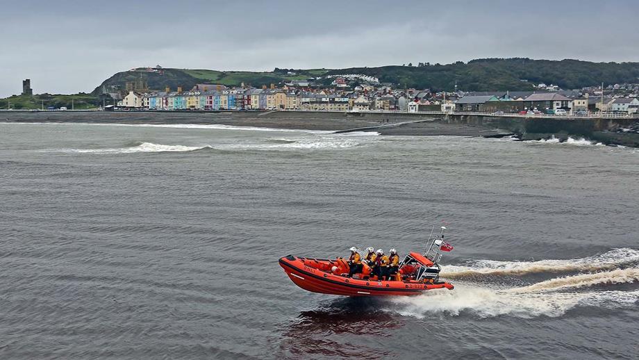 Aberystwyth RNLI’s Atlantic 85 heading out to sea, with the harbour behind
