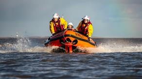 Three crew members from Cleethorpes RNLI onboard their D class lifeboat